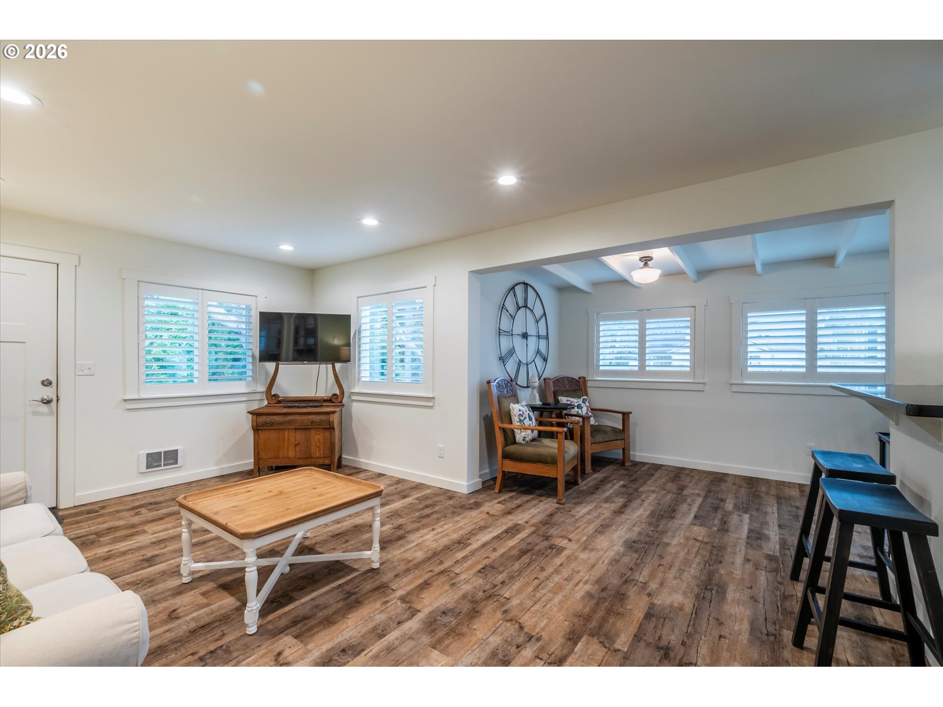 770 9th Street Southeast Bandon, OR 97411 - Photo 47 of 47 a living room with furniture a window and a flat screen tv