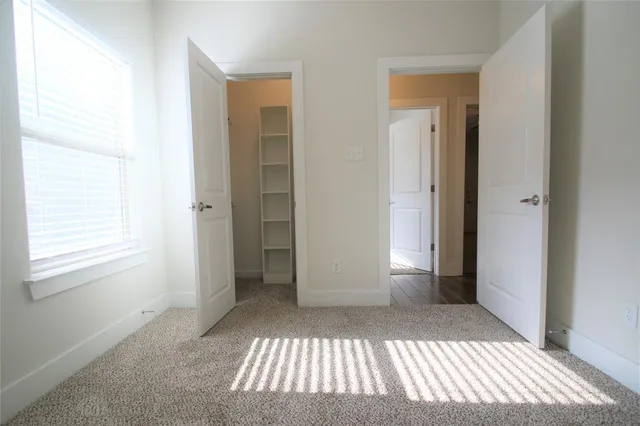 a view of bedroom with window