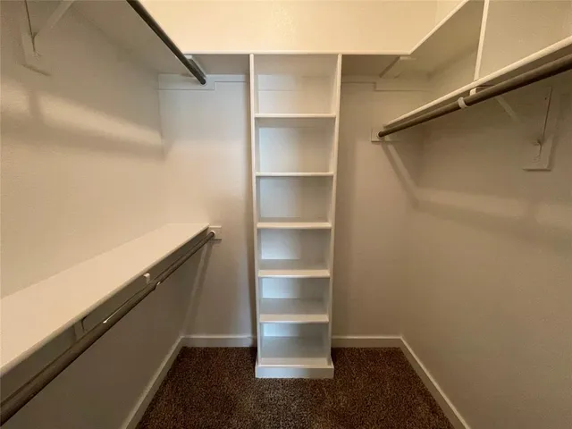 a storage room with wooden floor