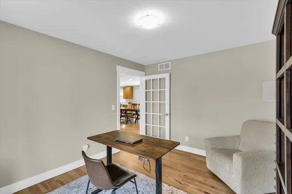 a view of a livingroom with furniture and wooden floor