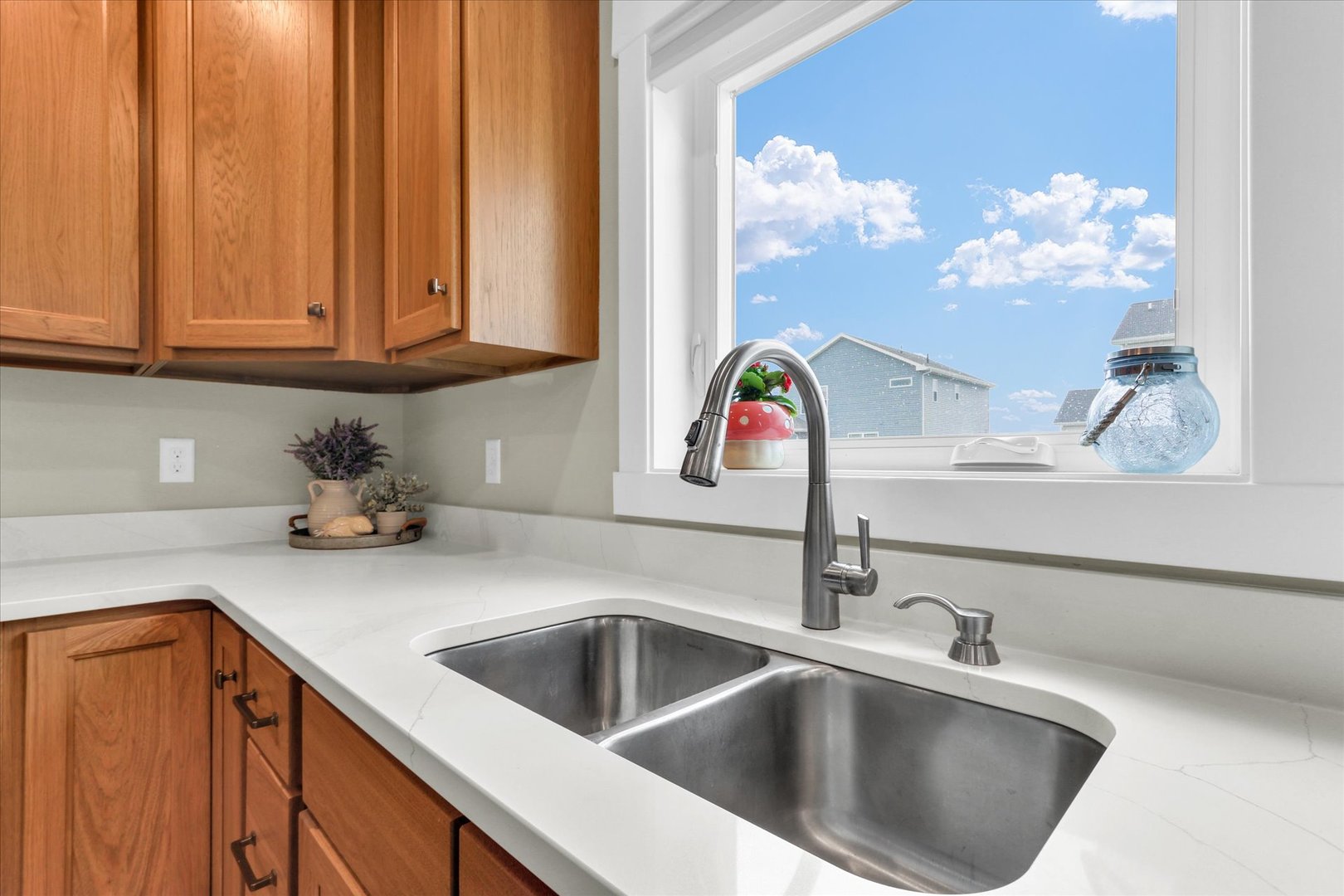 1403 Winterberry Road Savoy, IL 61874 - Photo 16 of 47 a kitchen with a sink cabinets and a potted plant