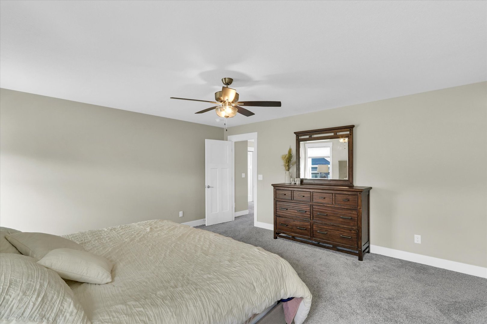 1403 Winterberry Road Savoy, IL 61874 - Photo 18 of 47 a bedroom with a bed and a chandelier