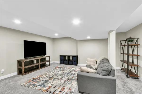 a balcony with furniture and wooden floor