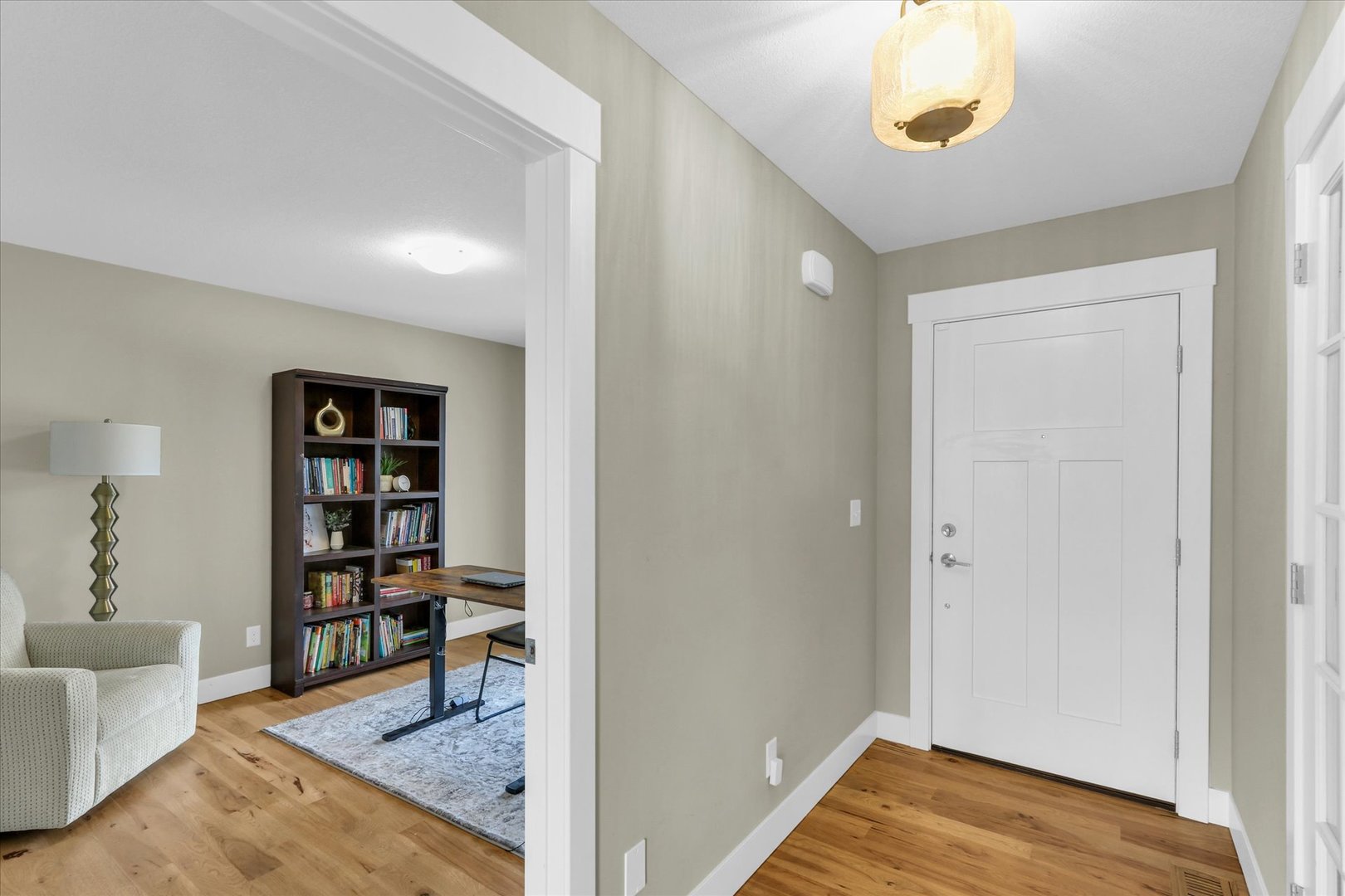 1403 Winterberry Road Savoy, IL 61874 - Photo 4 of 47 a view of a livingroom with wooden floor and cabinet