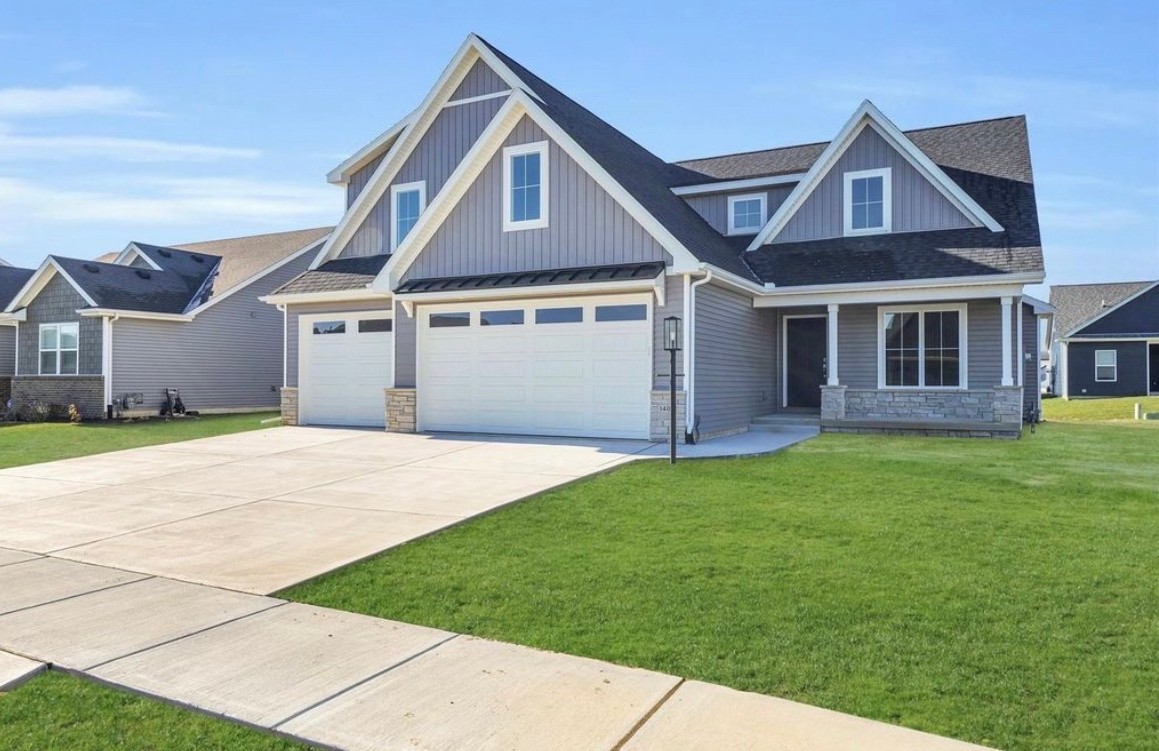 1403 Winterberry Road Savoy, IL 61874 - Photo 46 of 47 a front view of a house with a garden and yard