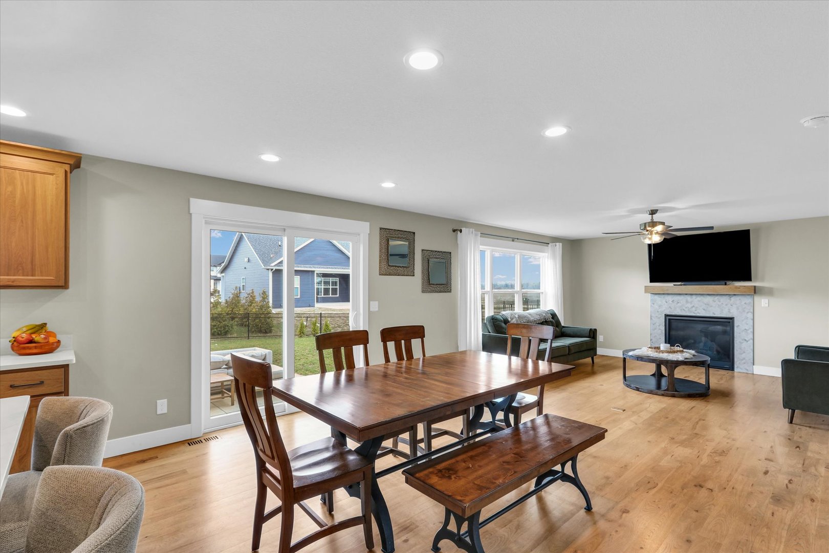 1403 Winterberry Road Savoy, IL 61874 - Photo 7 of 47 a view of a dining room with furniture a fireplace and wooden floor