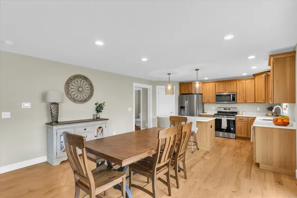 a very nice looking dining room with a table and chairs