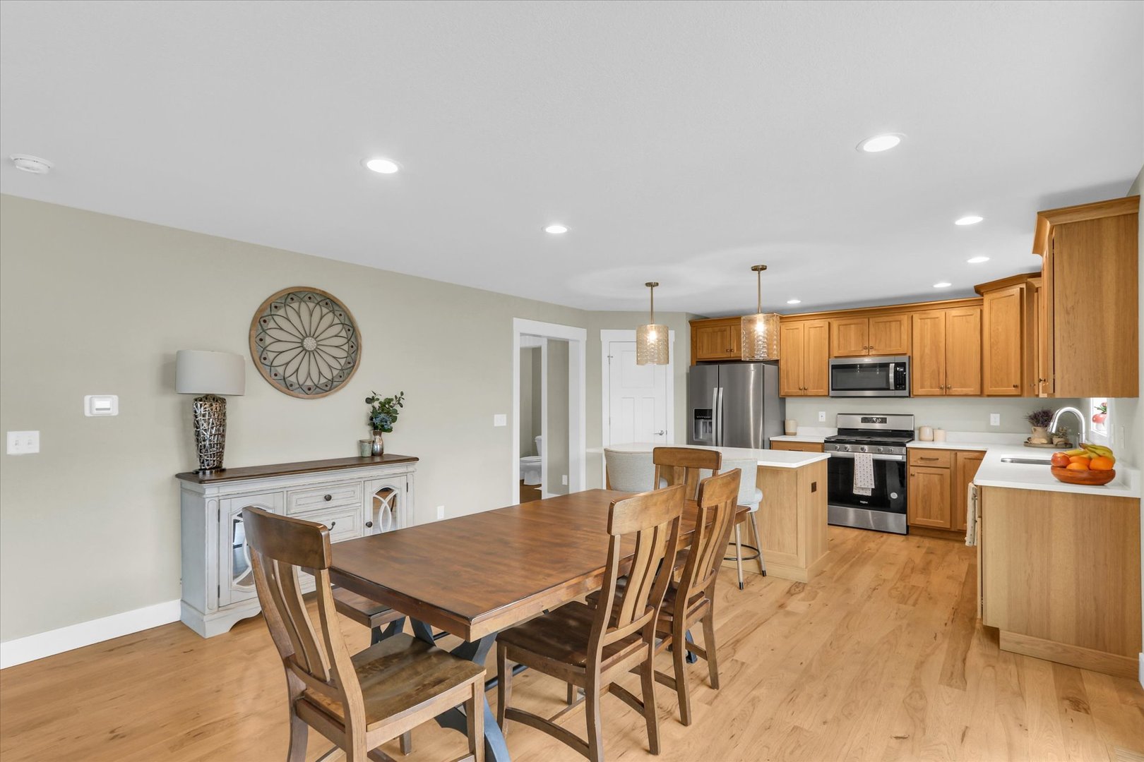 1403 Winterberry Road Savoy, IL 61874 - Photo 8 of 47 a view of a dining room with furniture and wooden floor