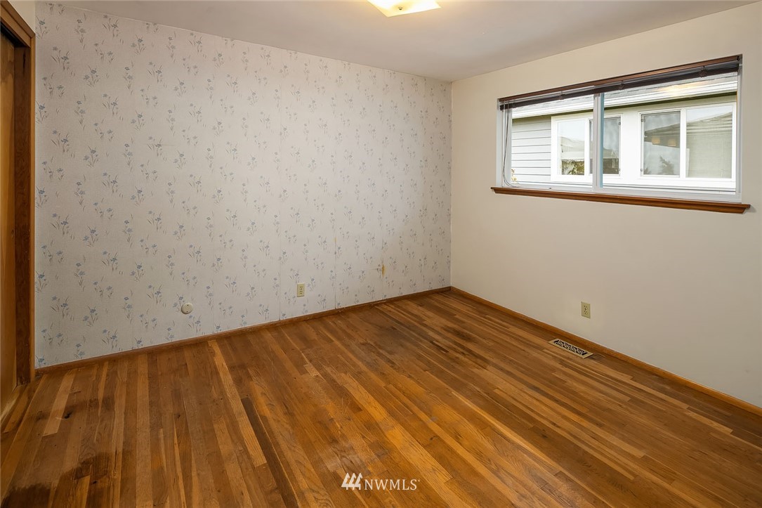 4216 Southwest Myrtle Street Seattle, WA 98136 - Photo 11 of 21 a view of empty room with wooden floor and fan