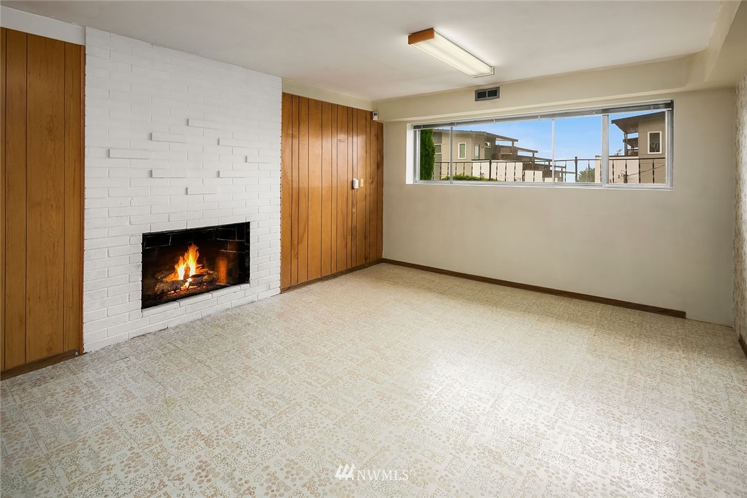 4216 Southwest Myrtle Street Seattle, WA 98136 - Photo 13 of 21 a view of an empty room with window and fire place