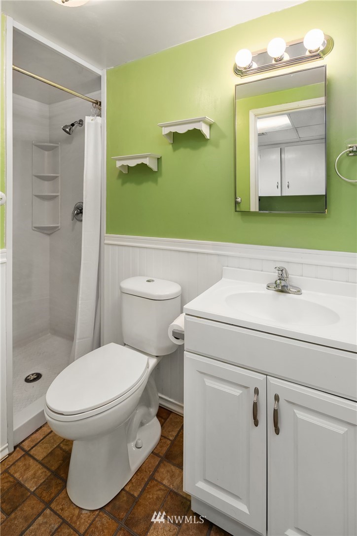 4216 Southwest Myrtle Street Seattle, WA 98136 - Photo 14 of 21 a bathroom with a sink toilet and shower