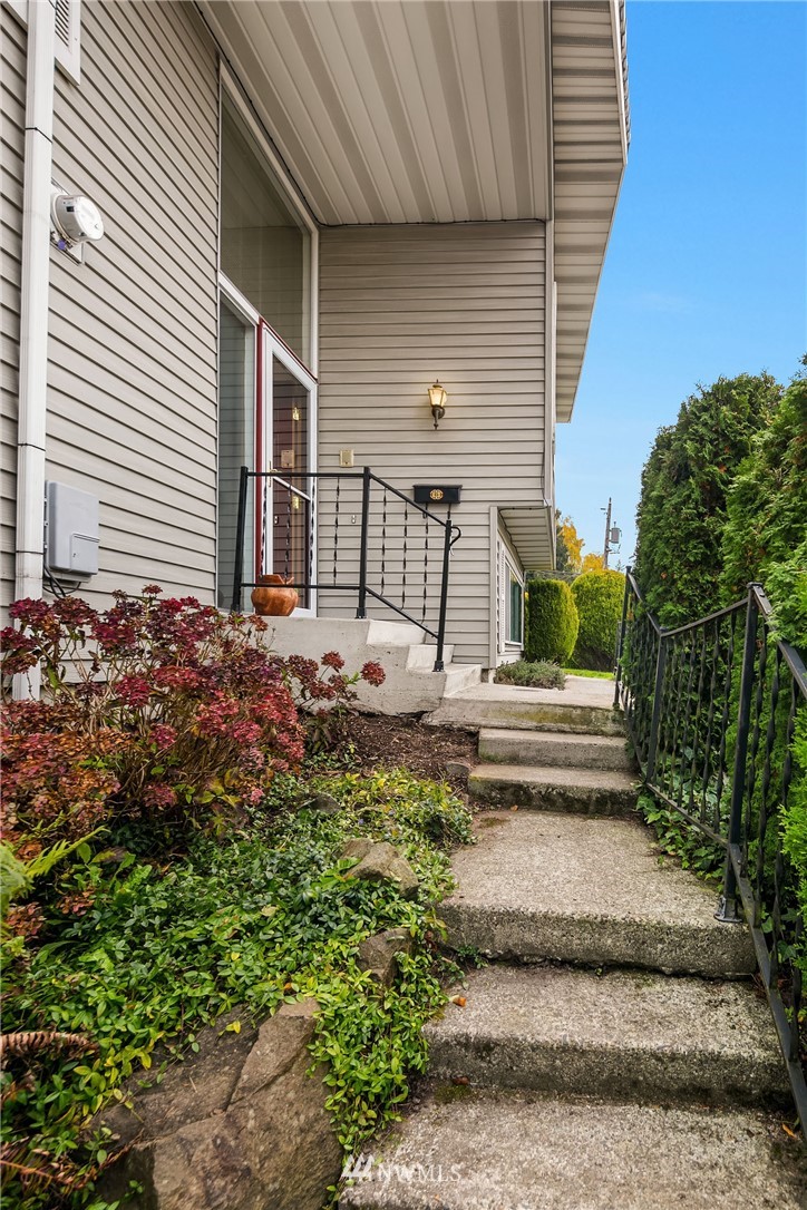 4216 Southwest Myrtle Street Seattle, WA 98136 - Photo 17 of 21 a front view of a house with a yard