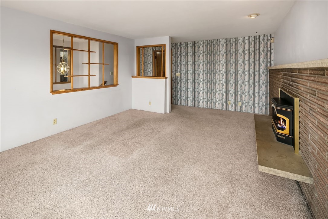 4216 Southwest Myrtle Street Seattle, WA 98136 - Photo 3 of 21 an empty room with windows