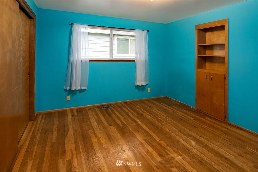 4216 Southwest Myrtle Street Seattle, WA 98136 - Photo 10 of 21 a view of a room with window and wooden floor