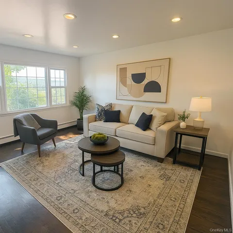 a living room with furniture and a rug