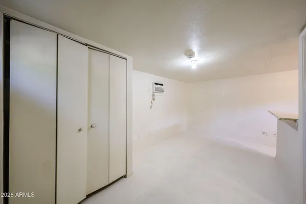 a bathroom with a shower and a glass door