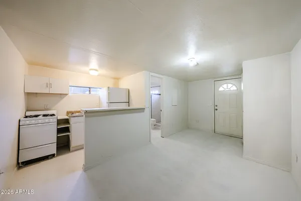 a kitchen with cabinets and stainless steel appliances