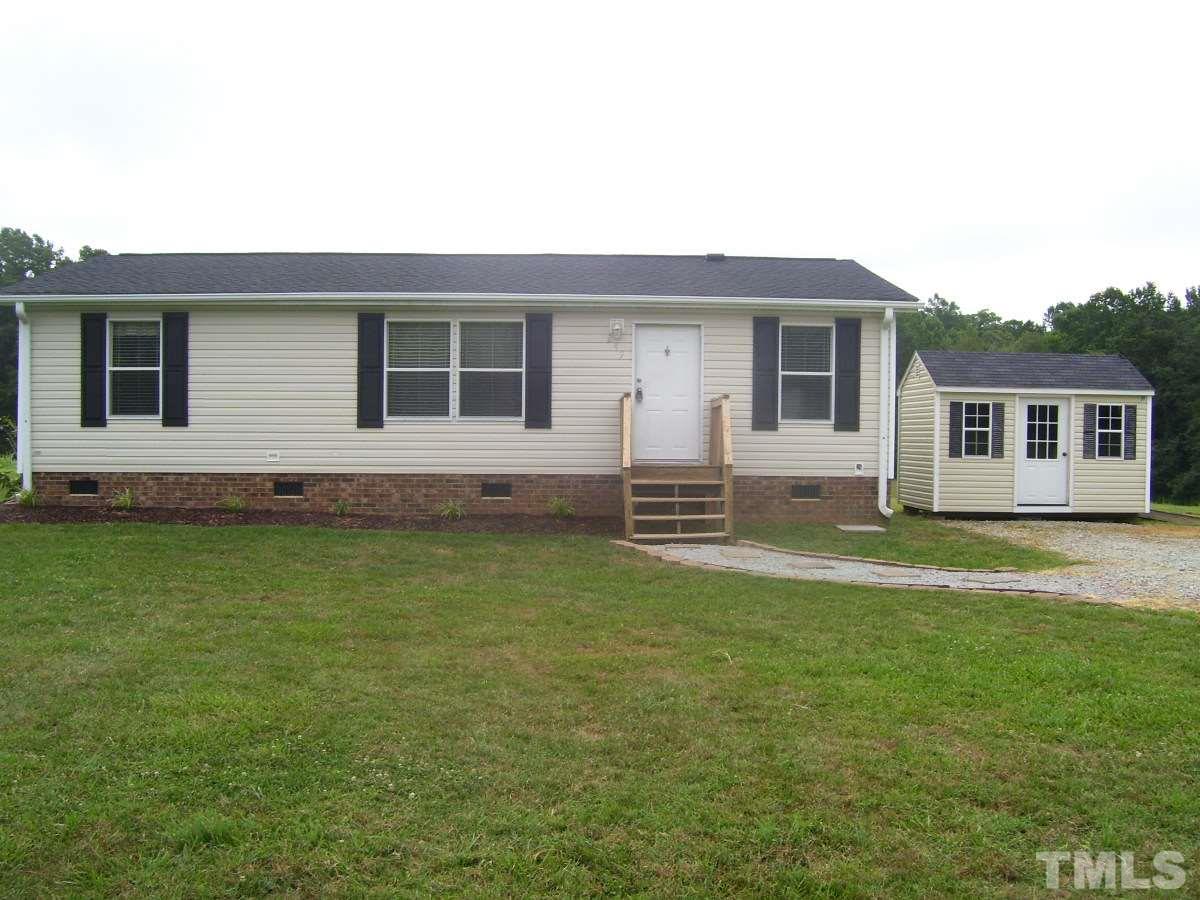 249 West O Painter Road Timberlake, NC 27583 - Photo 1 of 20 a house view with a garden space