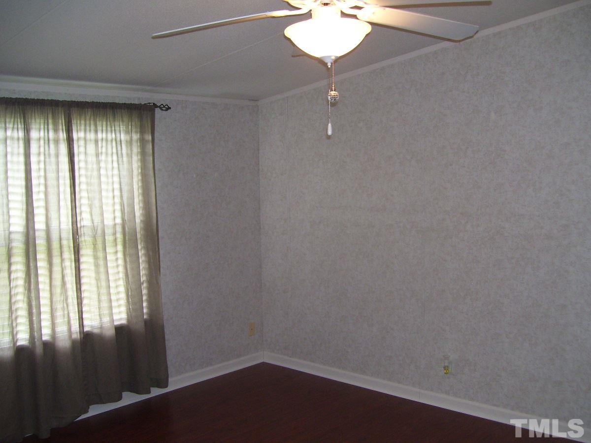 249 West O Painter Road Timberlake, NC 27583 - Photo 12 of 20 en empty room with a window