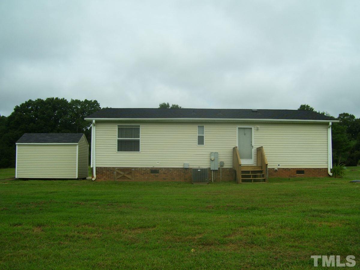 249 West O Painter Road Timberlake, NC 27583 - Photo 17 of 20 a backyard of a house with lots of green space