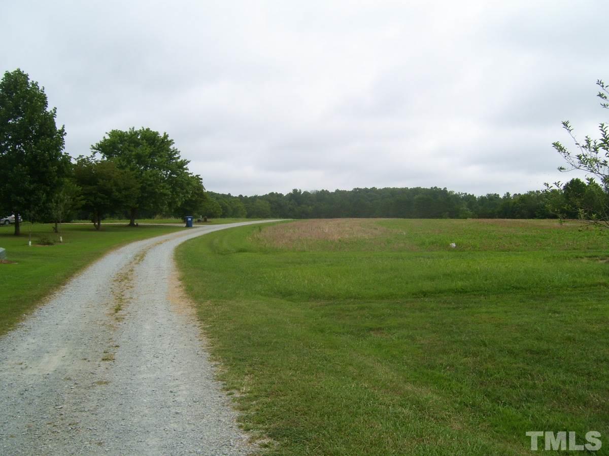249 West O Painter Road Timberlake, NC 27583 - Photo 20 of 20 a view of a golf course with a lake