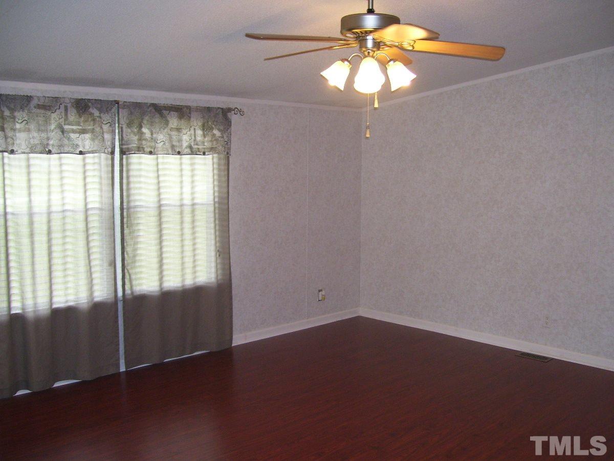 249 West O Painter Road Timberlake, NC 27583 - Photo 6 of 20 an empty room with a window