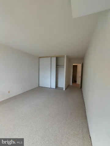 a view of an empty room with a large window