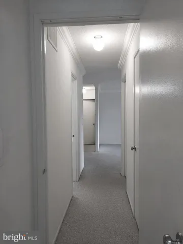 a living room with fireplace furniture and a large window