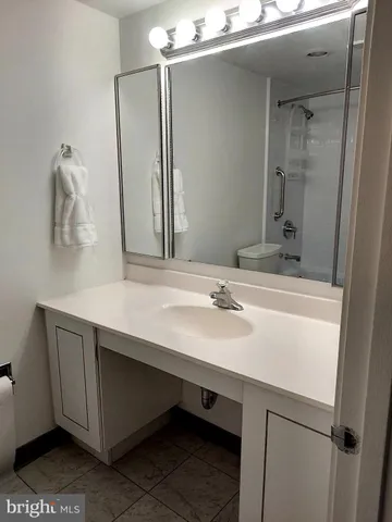 a view of a patio with table and chairs and potted plants