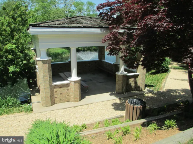a view of a house with a yard porch and sitting area