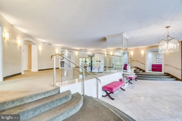a bathroom with a large tub and a flat screen tv