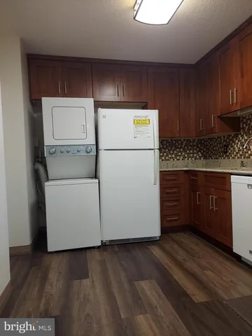 a stove top oven sitting inside of a kitchen