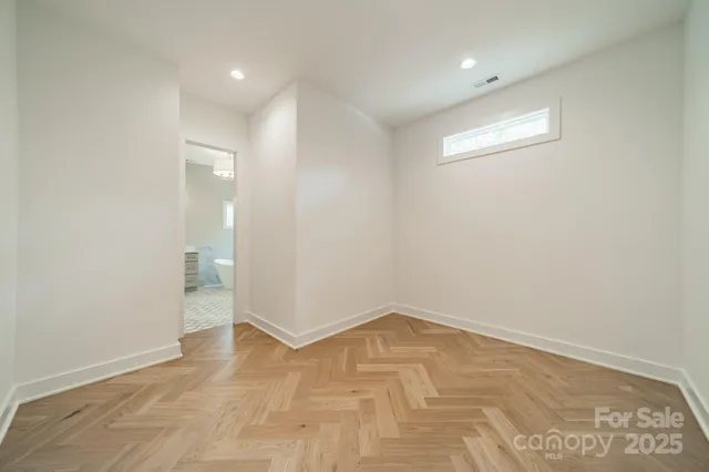 a spacious bathroom with a shower sink and mirror