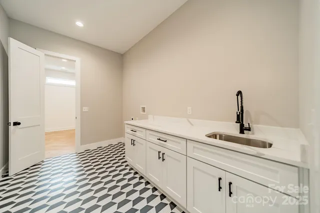 a bathroom with a double vanity sink mirror and