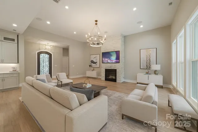 a bathroom with a double vanity sink mirror and bathtub