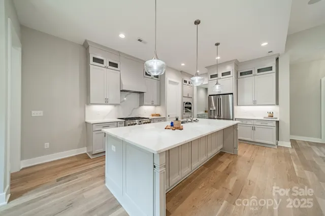 a house that has a tree in front of it