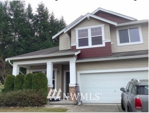 28040 Maple Ridge Way Southeast Maple Valley, WA 98038 - Photo 1 of 1 a front view of a house with a yard