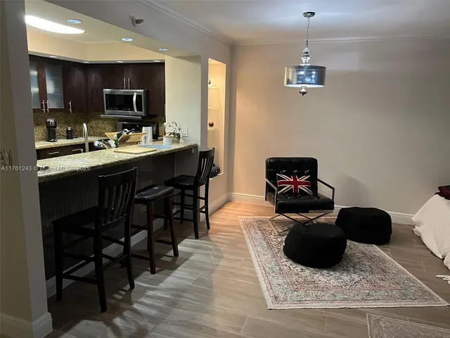 a kitchen with a sink appliances and cabinets