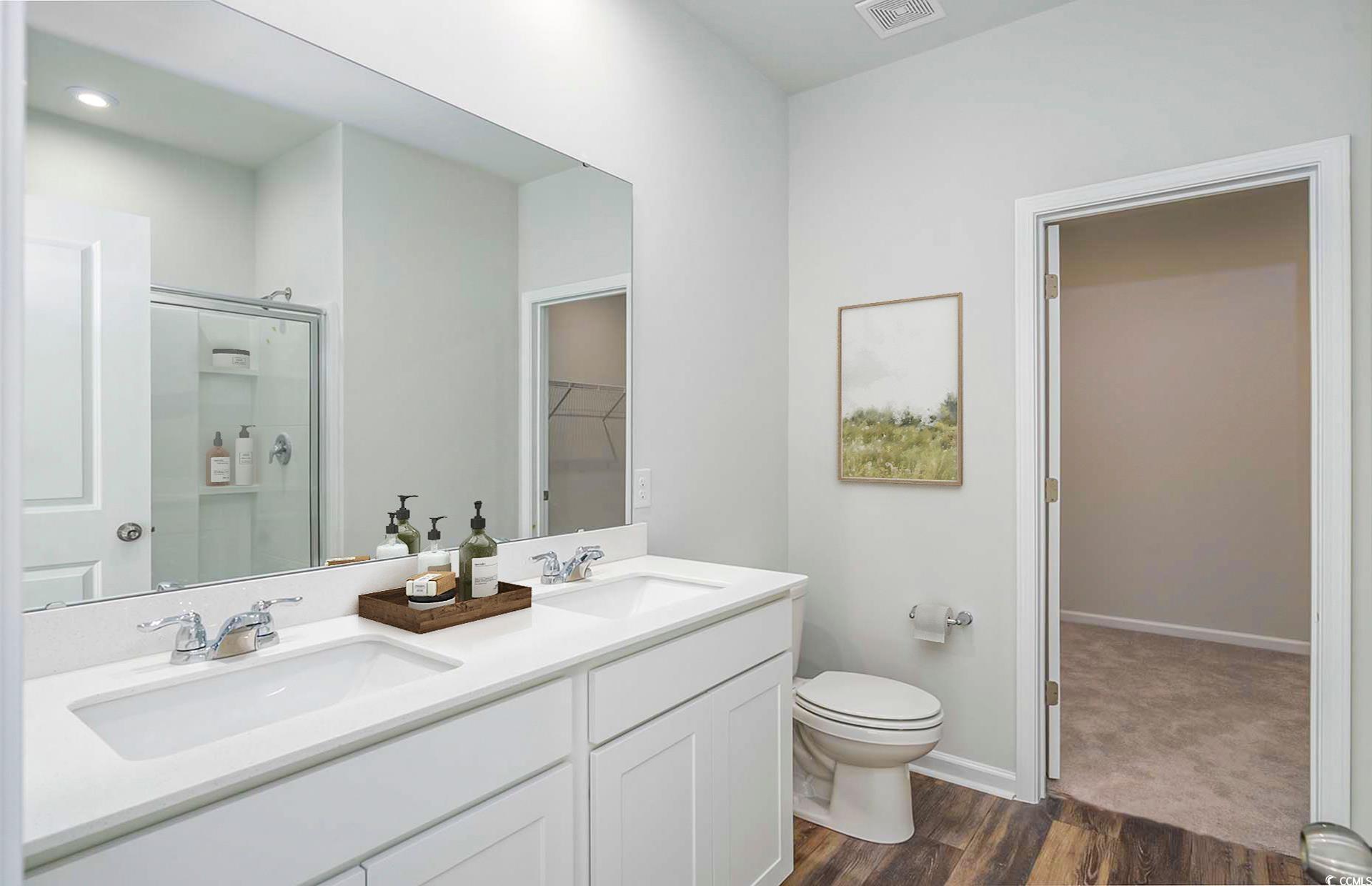 970 Laconic Drive Myrtle Beach, SC 29588 - Photo 12 of 13 Bathroom with hardwood / wood-style flooring, vani