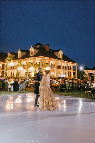 a view of a patio with table and chairs and potted plants