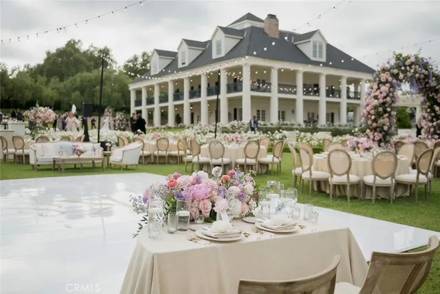 a view of pool with lawn chairs