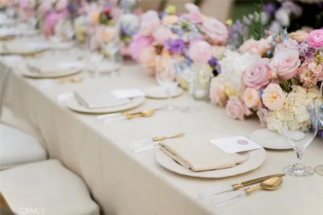a view of a patio with table and chairs potted plants