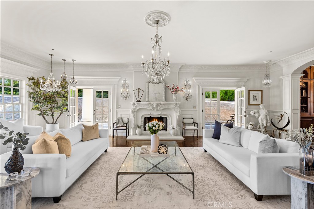 85 Crestview Avenue Camarillo, CA 93010 - Photo 34 of 62 a living room with furniture a chandelier and a fireplace