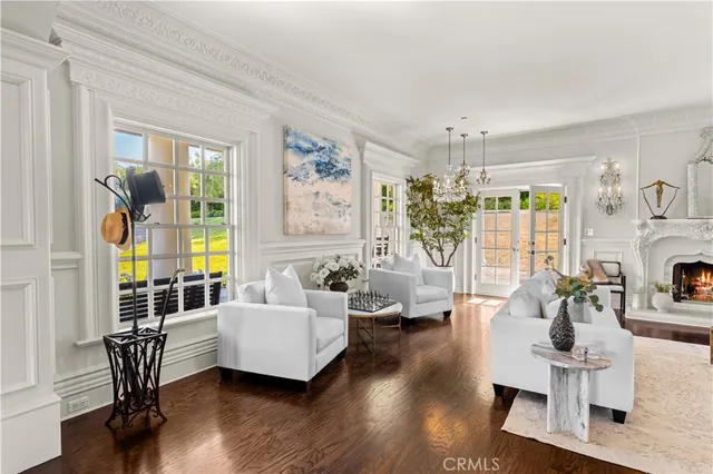 a view of a hallway with wooden floor windows and livingroom