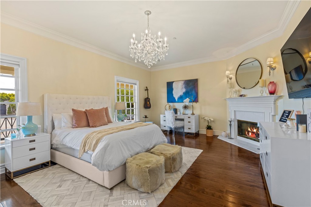 85 Crestview Avenue Camarillo, CA 93010 - Photo 46 of 62 a spacious bedroom with bed and a chandelier