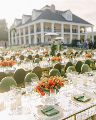 a group of people sitting in front of retail shop