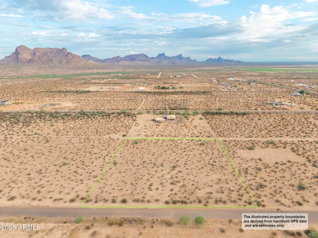 a view of an ocean beach and mountain