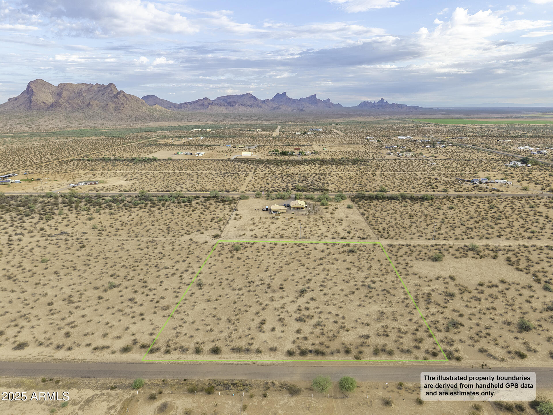 a view of an ocean beach and mountain