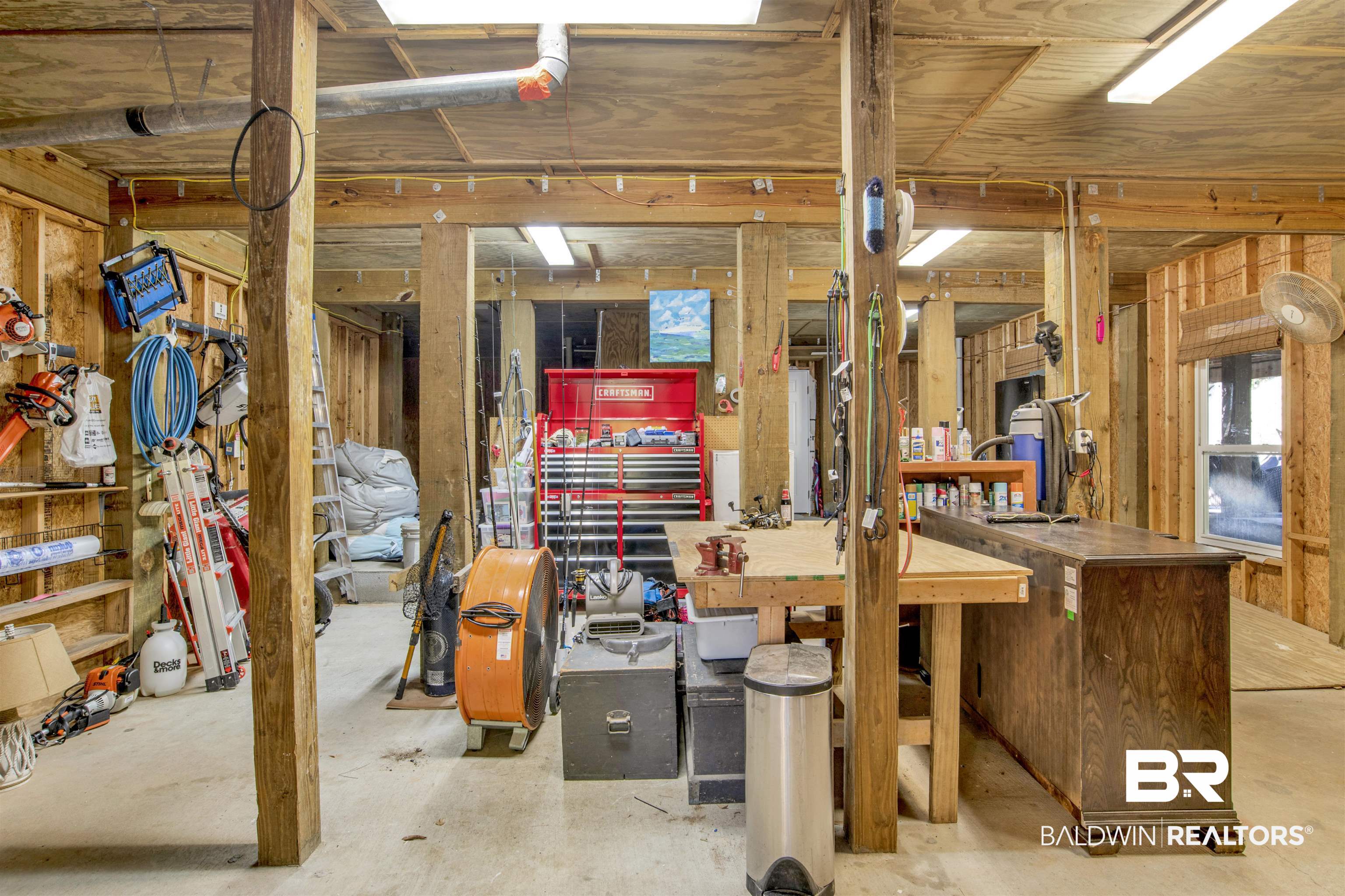 11463 Getchell Drive Theodore, AL 36582 - Photo 31 of 39 Basement with a workshop area