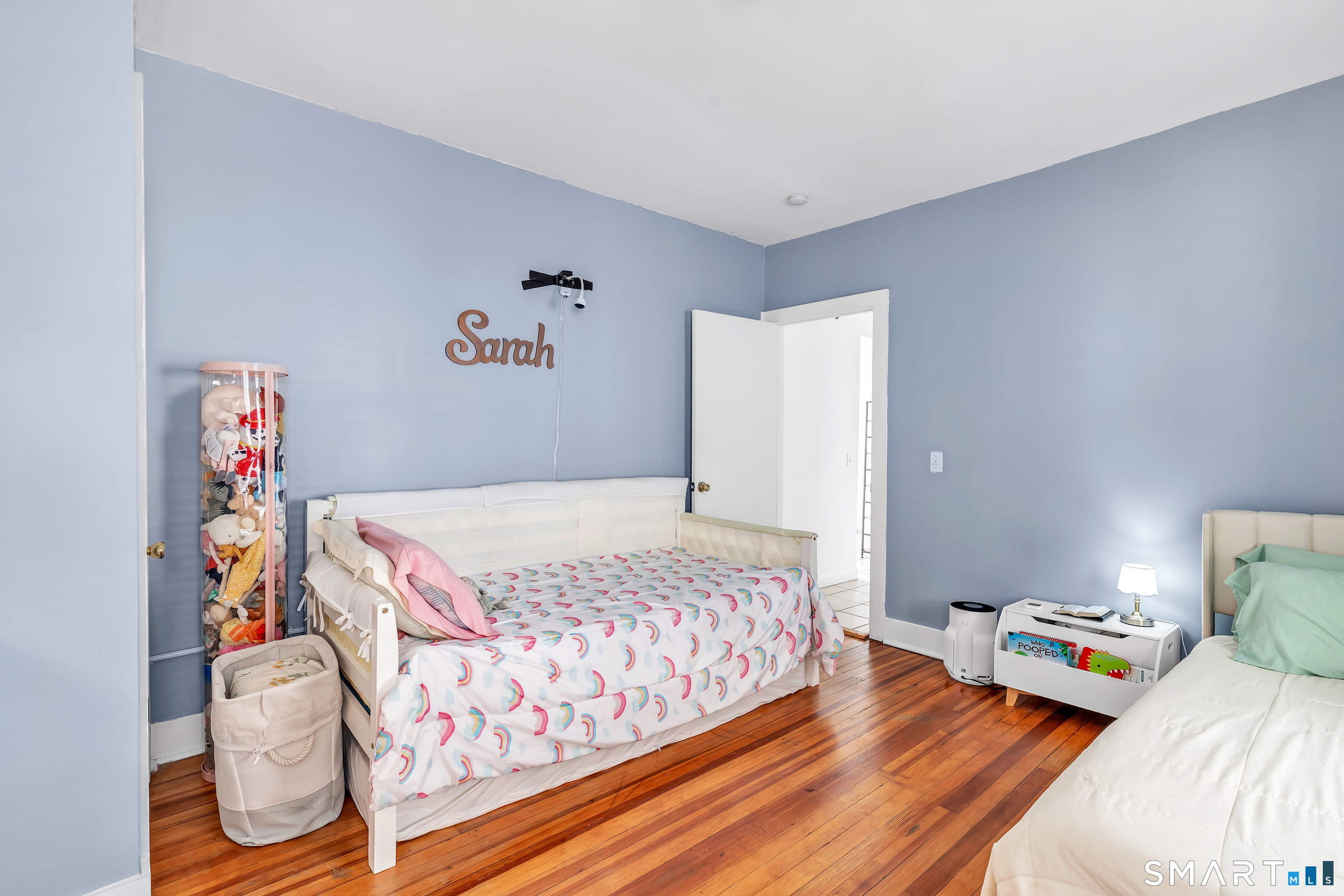 189 Wells Street Bridgeport, CT 06606 - Photo 16 of 40 2nd Floor - Offers 1389 sq ft -Shared LR & DR has operable wood burning fireplace, hardwood floors